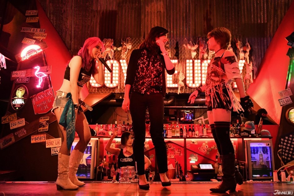 Invite female guests to go up on stage to perform together